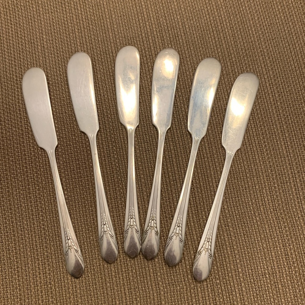 Vintage silver spreader knives